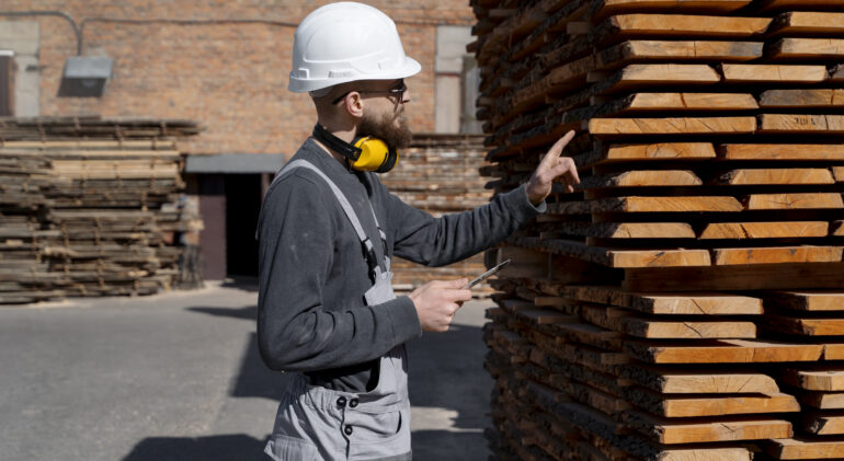 man working mdf boards warehouse