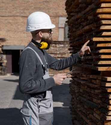 man working mdf boards warehouse